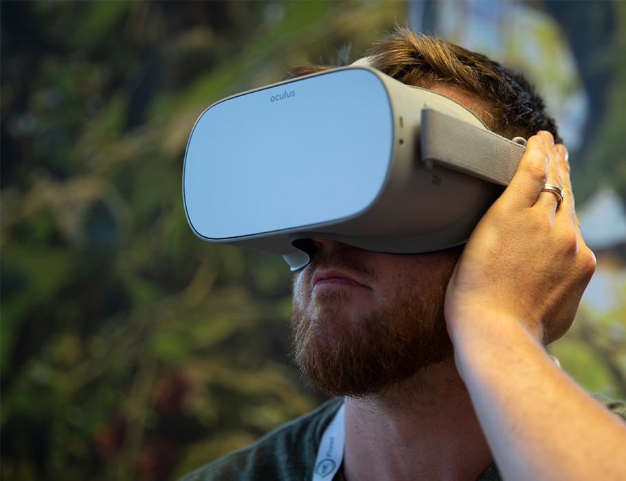 Man watching virtual reality with grey visor