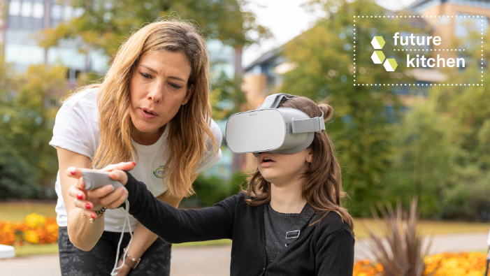 A woman and a child with virtual reality goggles